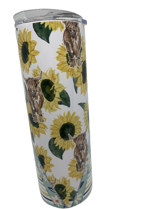 Highland cow in sunflowers